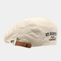 Detail of vintage beige beret featuring 1977 embroidery and brown leather back strap - Adjustable / Beige