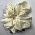Oversized cream satin scrunchie with soft pleats and a silky elegant glossy finish - Milk White