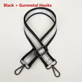 Detail of 3.8cm striped nylon strap with gunmetal swivel hooks and adjustable buckle - Black + Gunmetal Hook