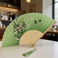 Classic green bamboo folding fan with flower pattern and matching green silk tassel - Style 48 (New Style)