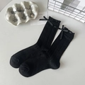 Sweet black rib-knit mid-calf socks with delicate lace ruffles and bow accents - One Size / Black