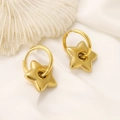 Close-up of golden star hoop earrings on white shell background with elegant aesthetic - 18K Gold Star (N-055)