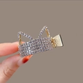 Close-up of golden claw clip with silver rhinestone cat ear design and high-gloss finish - Cat Gold Rhinestone
