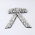 Detail of crystal bow hair clip featuring multifaceted rhinestones on black fabric base - Black Velvet with Full Rhinestones