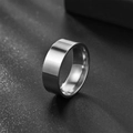 Polished silver 8mm stainless steel flat ring on a black textured background - US 8 / Silver