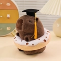 Plush capybara doll wearing a graduation cap with a white donut ring accessory - Donut / Grey-brown
