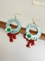 Detail of bohemian hoop earrings with colorful natural stones and floral resin accents - Shell Red Beaded Earrings / White and Red