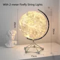 Minimalist illuminated globe with LED string lights and silver metal tripod base - Globe - White + Light String