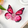 Rose red butterfly hair claw clip with black wing patterns on a soft white background - Red Butterfly