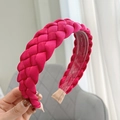 Close-up of rose red braided fabric headband showing the inner plastic comb and soft ends - Rose Red