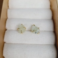 Minimalist gold-plated stud earrings featuring natural irregular pale green gemstones - Prehnite