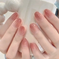 Short almond press-on nails with nude pink blush gradient and glossy finish on hand - Bs2055# Jade-like Round Pearl / Phototherapy Glue Style