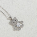 Silver bear necklace with sparkling zircons and a central heart-shaped white stone - Platinum White Heart (XL2572-7)