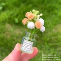 Miniature glass vase with orange daisies, tiny tabletop decor shown in hand for scale - [Luminous] White + Orange Vase