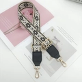 Detail of bohemian style woven bag strap with geometric patterns and gold lobster clasps - Gold Hook / Beige Black with Black Leather
