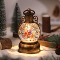 Dettaglio della lanterna natalizia vintage in bronzo con Babbo Natale e luce LED calda - Stile Renna e Babbo Natale