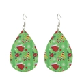 Macro detail of tear-drop faux leather earrings with festive green holiday patterns - Green Base Holly Santa Hat