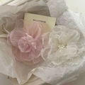 Detail of pink and white gauze camellia hair clips with pearls on crinkled paper - 2-Piece Set / Off-white + Pink