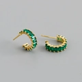 Macro view of gold S925 silver C-shaped hoop earrings with green zircon emerald cuts - Green Zirconia (Gold)