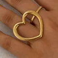 Golden double-finger ring with oversized hollow heart design in minimalist style - Gold (KB681)