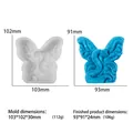 Macro detail of snake wing silicone mold with dimensions and finished blue candle - Spirit Snake Butterfly Wings