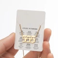 Golden 555 angel number necklace with retro font on a symbolic meaning display card - 555 / Gold