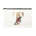 White canvas makeup bag with black zipper featuring floral golden letter T design - Letter T