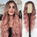 Lace front long wavy wig featuring ombre pink color from dark roots to light pink ends - Black to Pink Ombre