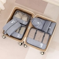 7-piece grey travel luggage organizer set with mesh bags packed in a beige suitcase - Gray 7-Piece Set