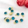 9 pieces of gold DIY alloy pendants with blue rhinestones on white fabric - Gold December - Dark Blue