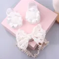 Detailed view of white lace bow headband and floral socks in a soft pink gift box - Style 37 (White Flower Shoe/Cream Lace)