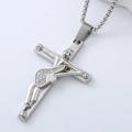 Macro view of silver crucifix pendant with white zircon inlays on a stainless steel chain - Crucifix Jesus Cross Pendant