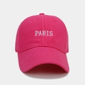 Detailed close-up of white PARIS embroidery on a pink cotton twill baseball cap - Rose Red