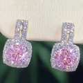 Classic halo pink round gemstone stud earrings with sparkling cubic zirconia accents - Pink