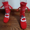 Magnetic holding hands Christmas socks in red featuring reindeer patterns and 3D arms - Red Merry Christmas Hand Holding