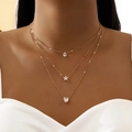Elegant gold layered necklace with sparkling zircon star, heart, and teardrop pendants - Gold