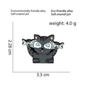 Grey striped cat enamel pin with light blue fish design made of eco-friendly alloy - Striped Cat with Fish