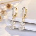 Golden ship anchor hoop earrings with sparkling white pavé stones in a coastal style - Helm (NN378)