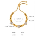 Gold-plated beaded bracelet with three heart pendants and mud drill accents, model E413 - Heart Rhinestone Style (E413) / Gold