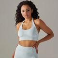Close-up of seamless light blue yoga top with ribbed hem and high-stretch fabric detail - Light Gray