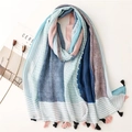 Detail of light cotton-linen scarf with blue stripes and heart patterns and fringe - Light Blue
