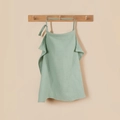 Detail of light green cotton waffle nursing cover with adjustable neck strap on hook - Bean Green with Metal Buckle