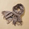 Classic beige cashmere-like pashmina scarf with elegant long tassels and material label - Camel