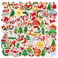 Vista piatta di vari adesivi natalizi olografici colorati per decorazione di regali - 100 Pezzi Adesivi Natalizi Per Bambini (4-5cm)