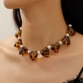 Leopard resin heart and pearl necklace displayed on a model for a vintage aesthetic - White K Heart Leopard Resin Pearl Style (3885)