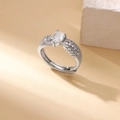 Detail shot of a silver ring with a drop-shaped clear stone and leaf-like crystal setting - Adjustable Open / Silver Pear Shape Gem Style (P4127579)