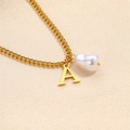 Golden necklace featuring a Baroque pearl and a minimalist capital letter A pendant - Letter A Necklace