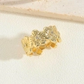 Close-up of 14K gold plated flower ring with sparkling zircon stones on stone surface - Flower Style-3 (JZ0349-6)