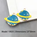 Saturn shaped enamel pendants with moon and star details, blue and yellow color, 23x26mm - Planet 23x26mm-10835