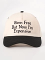Détail de la broderie Born Free et de la visière noire contrastée sur la casquette - Crème/Noir